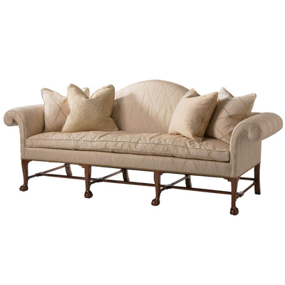 Elegant Irish Camelback Sofa with plush cream cushions
