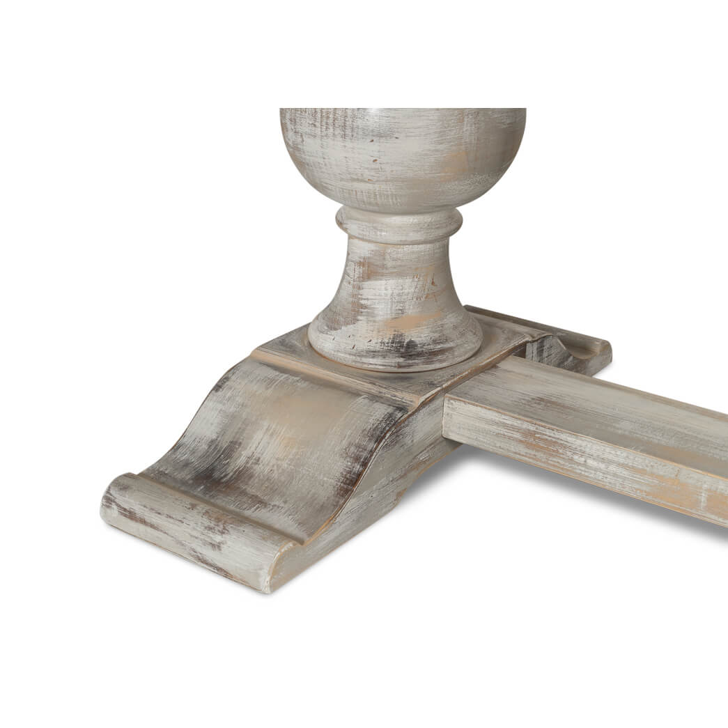 Close-up of ornate base detail on dining table.