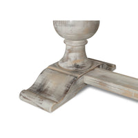 Close-up of ornate base detail on dining table.