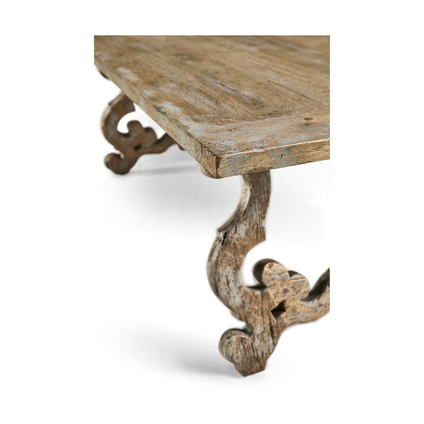 Corner perspective, highlighting ornate leg on oak table.