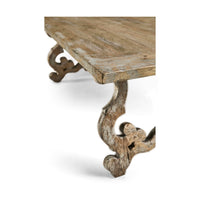 Corner perspective, highlighting ornate leg on oak table.