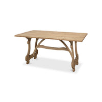 Wooden dining table angled view with ornate legs.