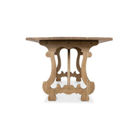 End view highlighting dining table's intricate leg design.