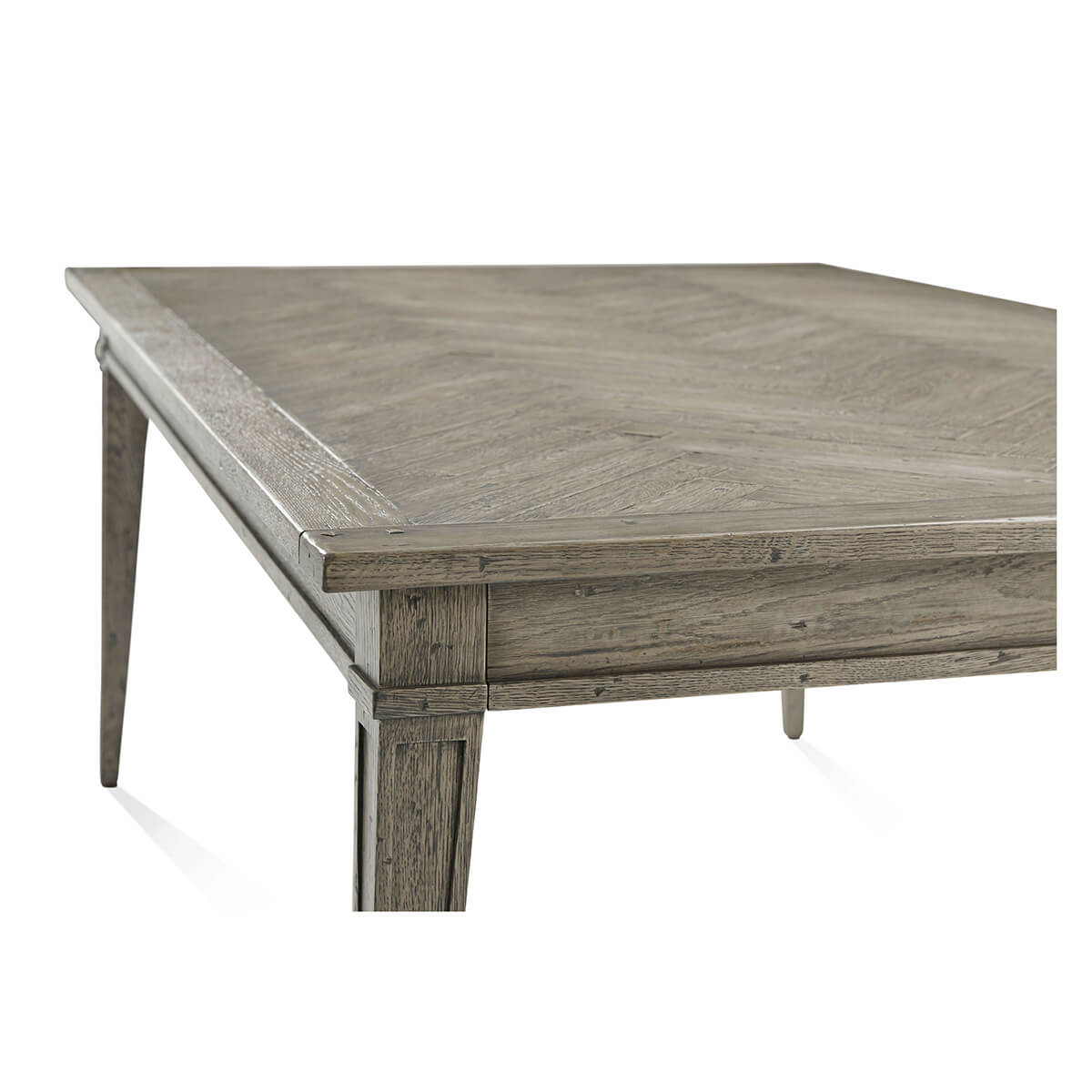 Close-up of grey oak dining table edge.