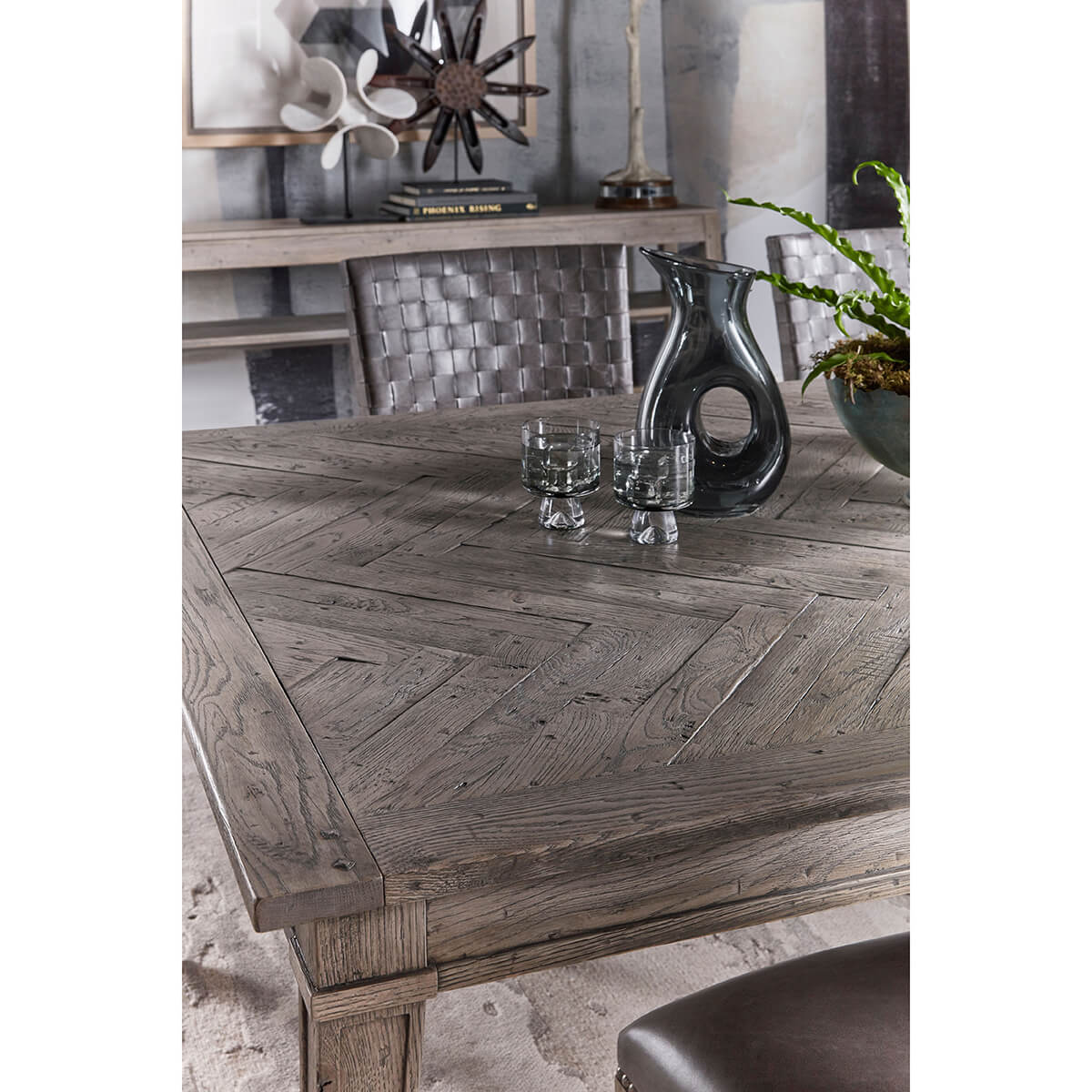 Styled tabletop with decor on grey oak dining table.