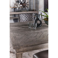 Styled tabletop with decor on grey oak dining table.
