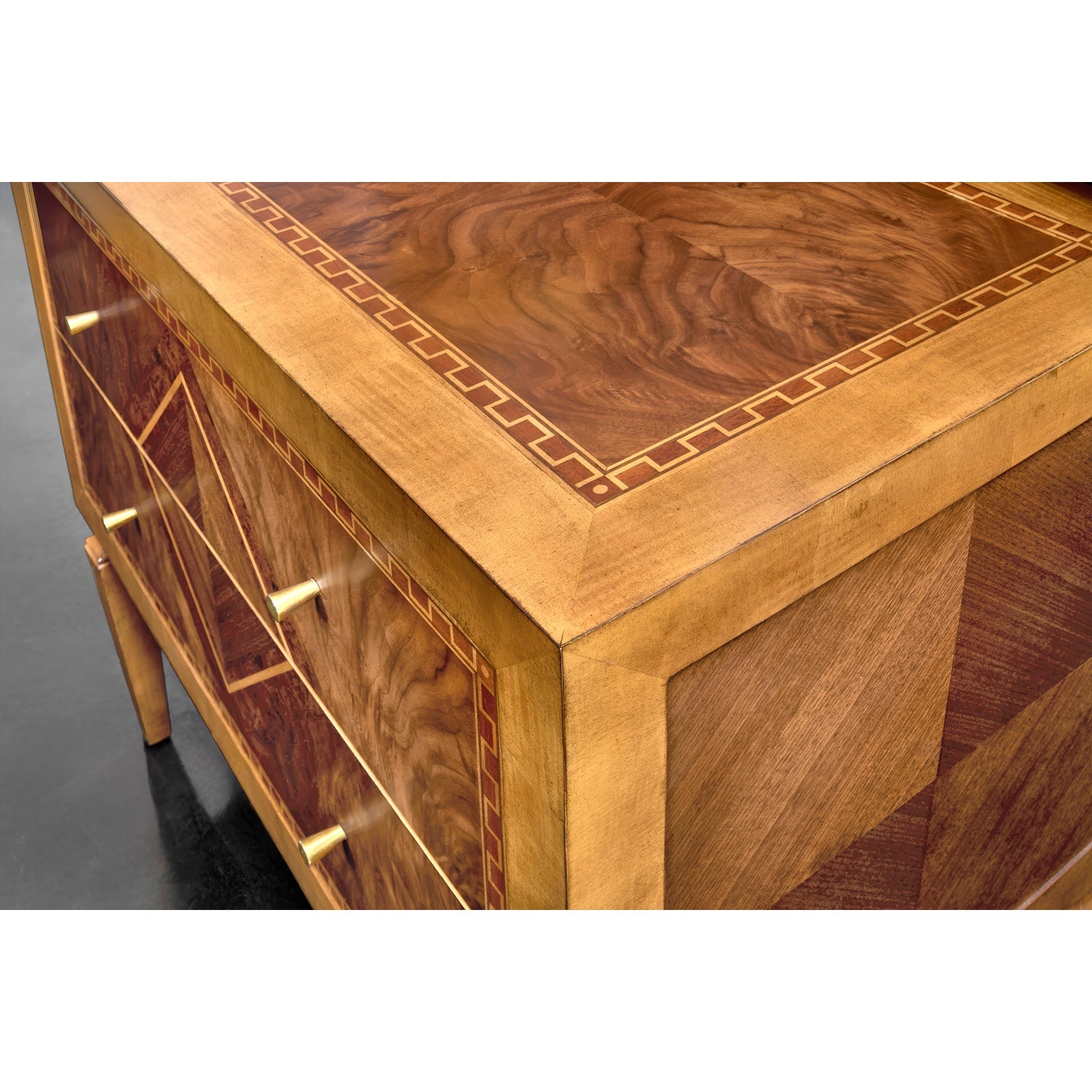 Close-up of nightstand inlay and wood details.
