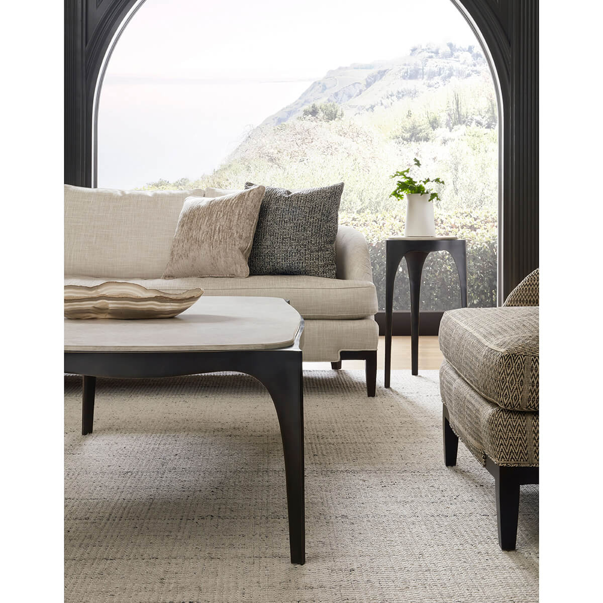 Accent table in a cozy living room setting with sofa.