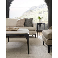 Accent table in a cozy living room setting with sofa.