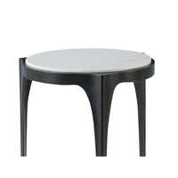 Close-up of round side table, marble top detail.