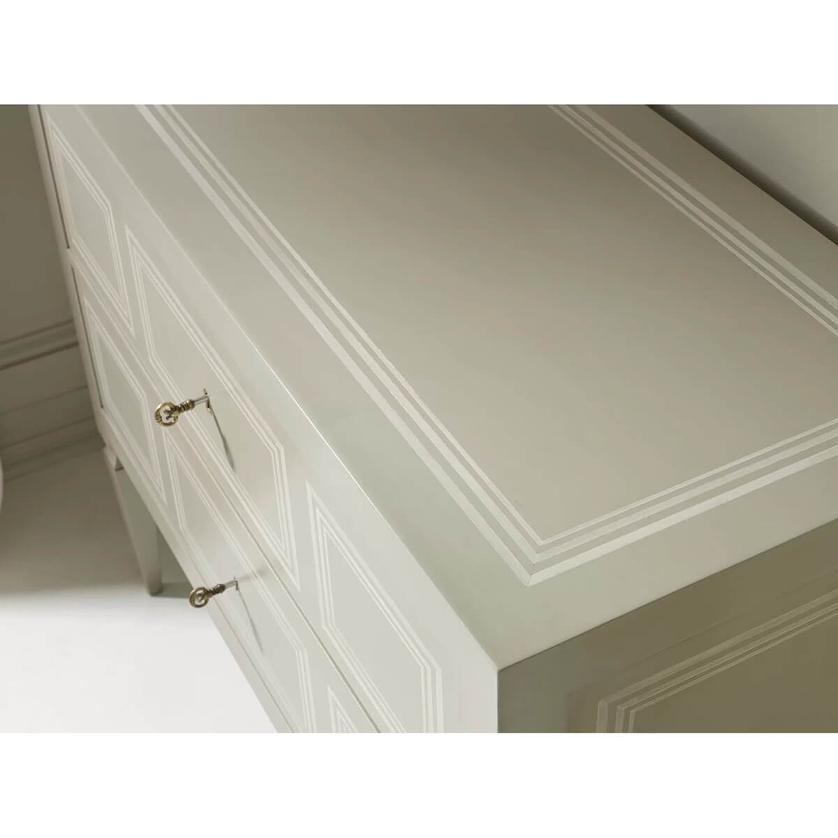 Close-up of Italian Neo Classic commode top and drawer details.