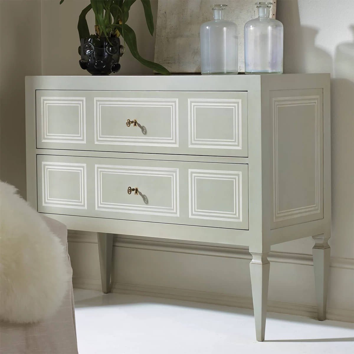 Italian Neo Classic commode in living room setting.