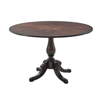 Round Italian Provincial dining table with ornate design.