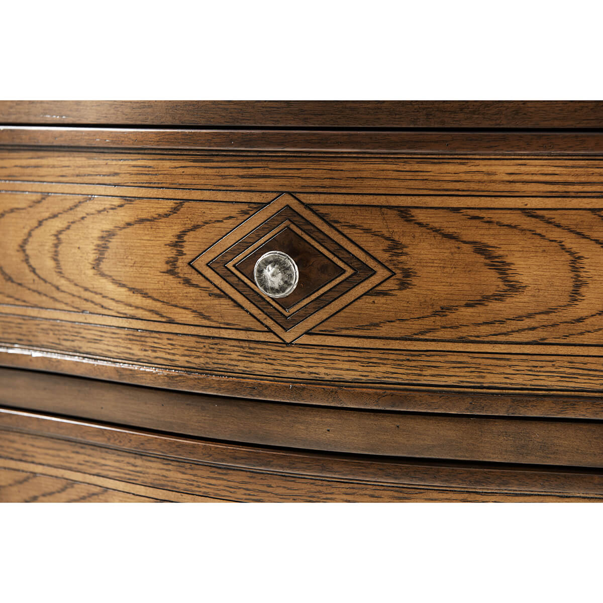 Close-up of Italian Provincial nightstand drawer handle.
