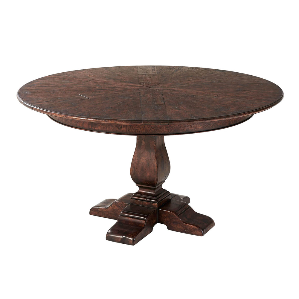 Round dining table with pedestal base, overhead view.
