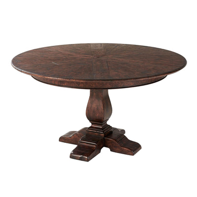 Round dining table with pedestal base, overhead view.