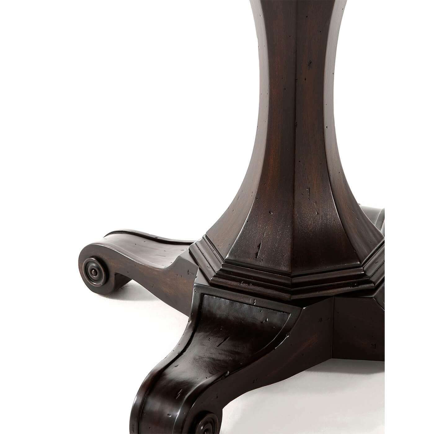 Close-up of round game table leg design.