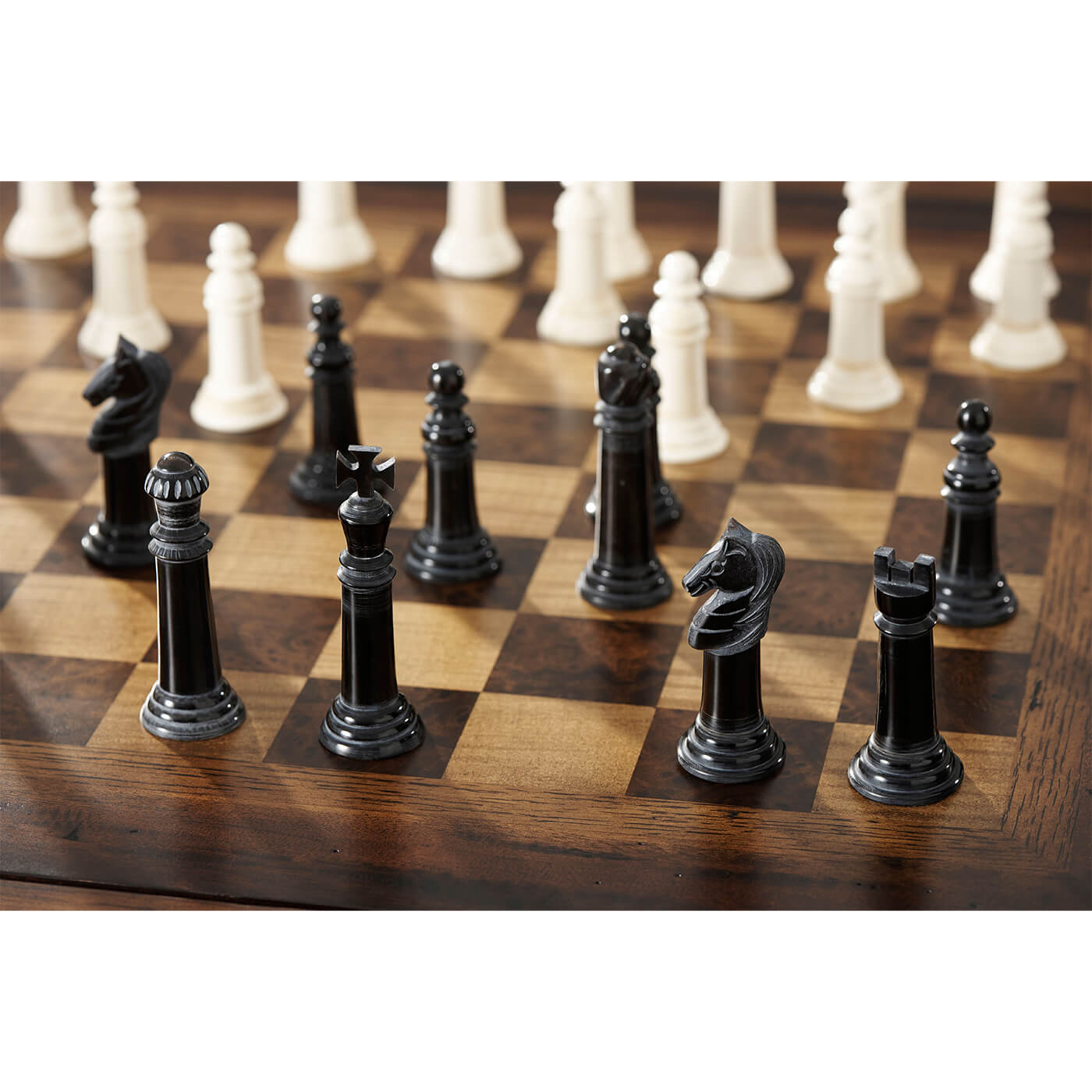 Close-up of chess pieces on game table.