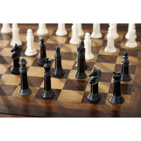 Close-up of chess pieces on game table.