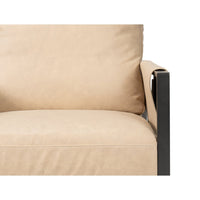 Close-up of seat and armrest in accent chair.