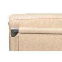 Top detail of ivory leather accent chair.