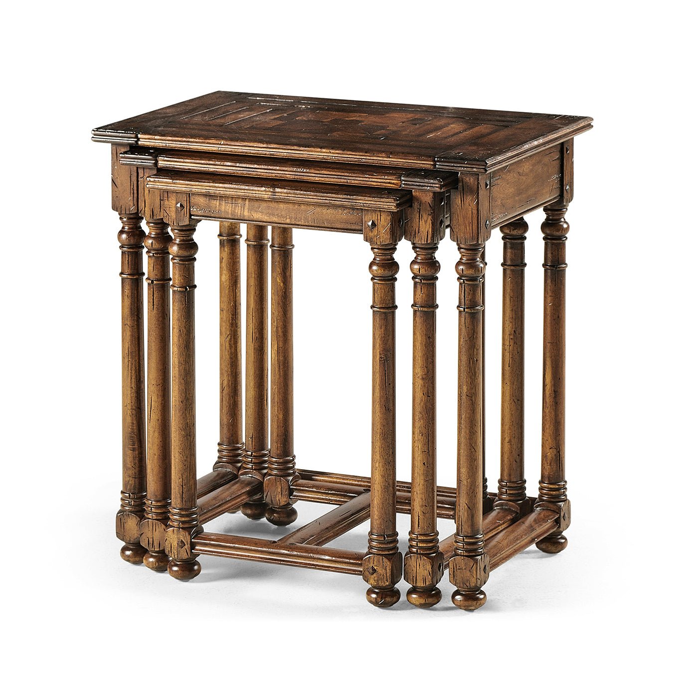 Jacobean nesting tables neatly assembled together.