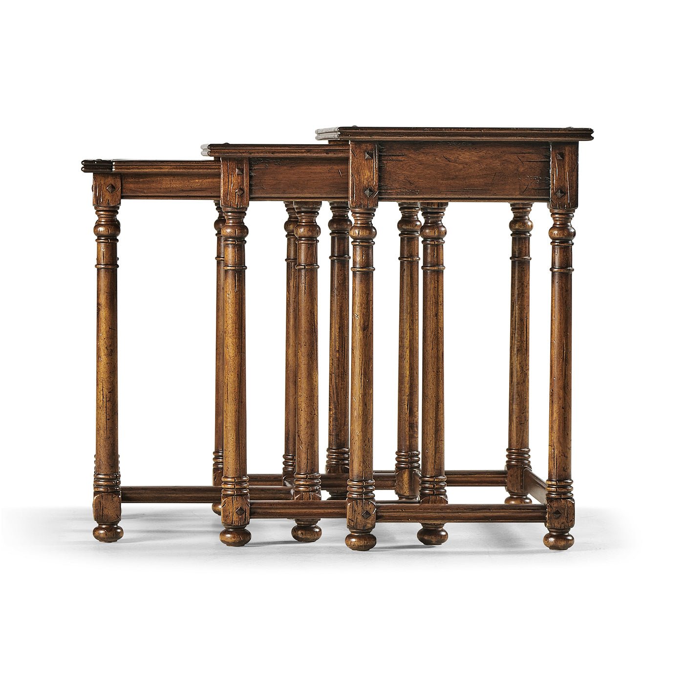 Side angle of three Jacobean nesting tables.