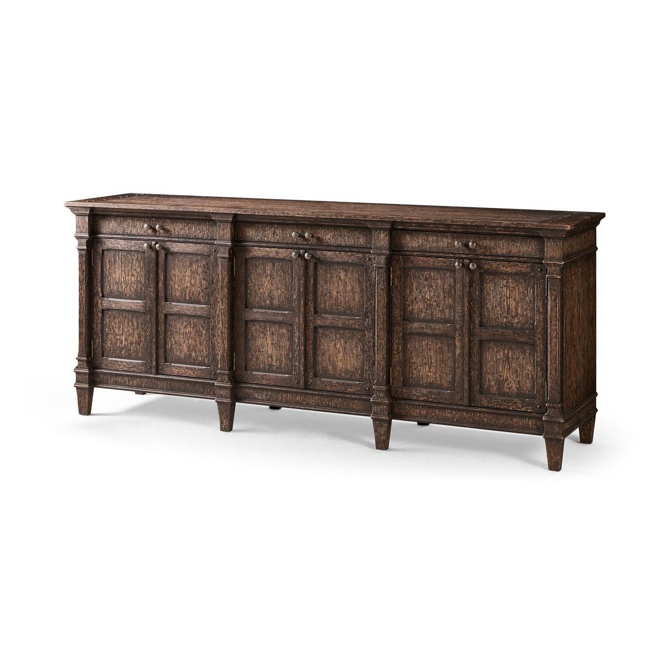 Jacobean oak sideboard with closed cabinets, angled view.