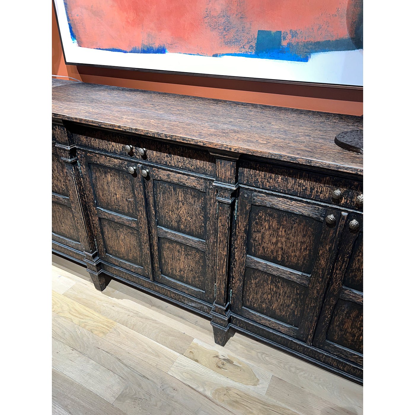 Close-up of sideboard detailing and cabinet knobs.