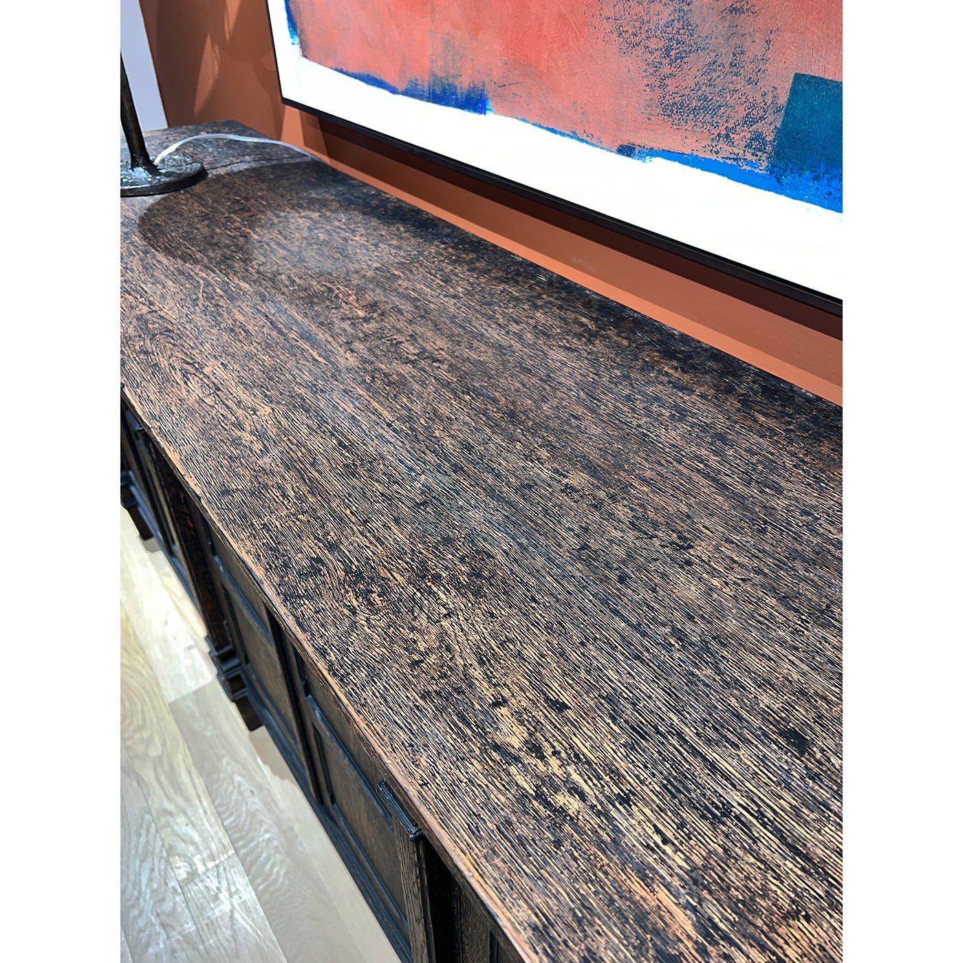 Close view of textured sideboard top surface.