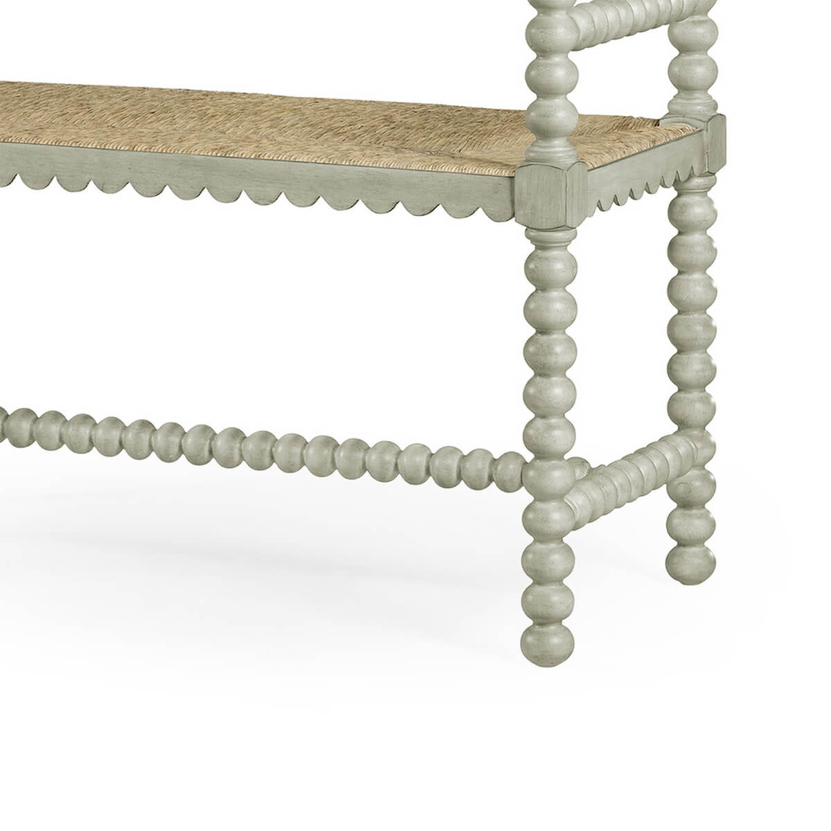 Side view of grey Jacobean bench, intricate spindle legs.