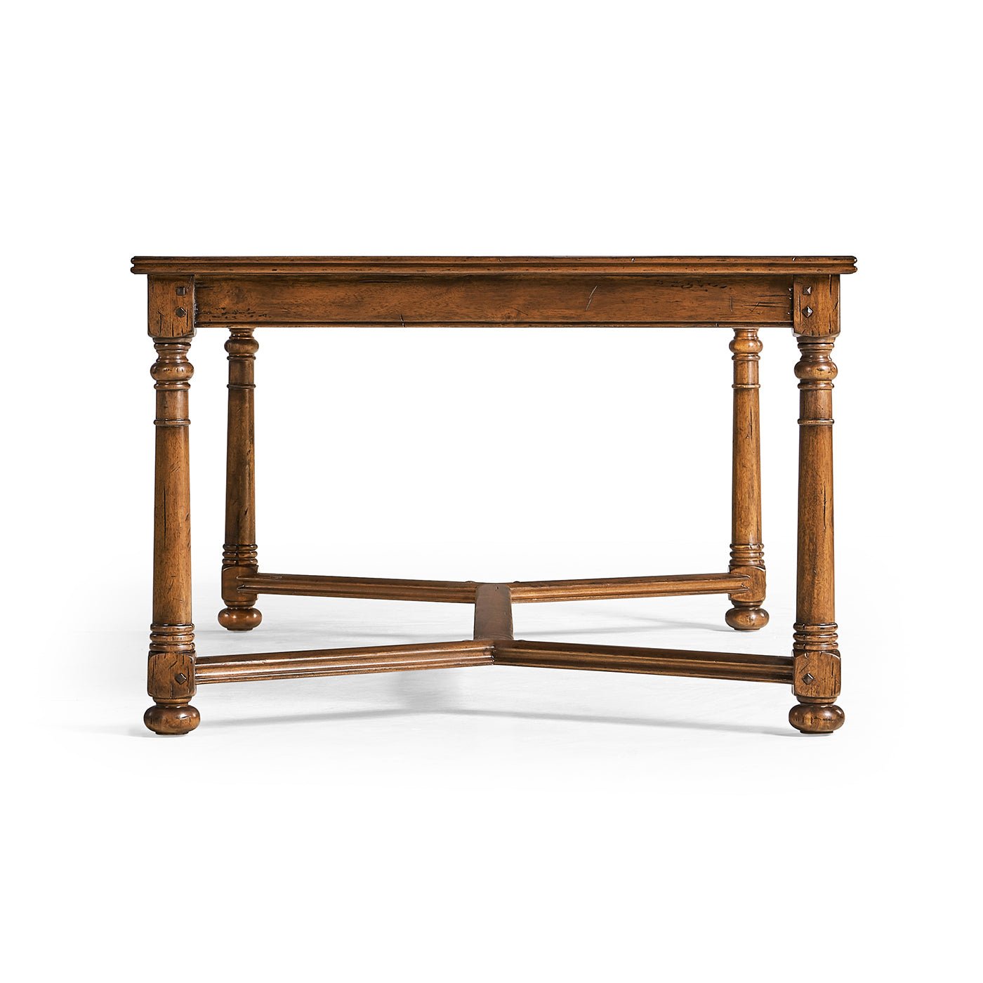 Side perspective of Jacobean walnut coffee table with legs.