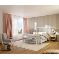 Styled bedroom with white king size spindle bed frame.