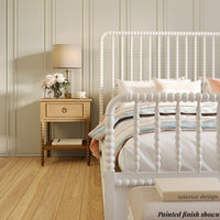 King size spindle bed frame, white finish in styled bedroom.