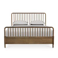 Front view of king size spindle bed frame with pillows.