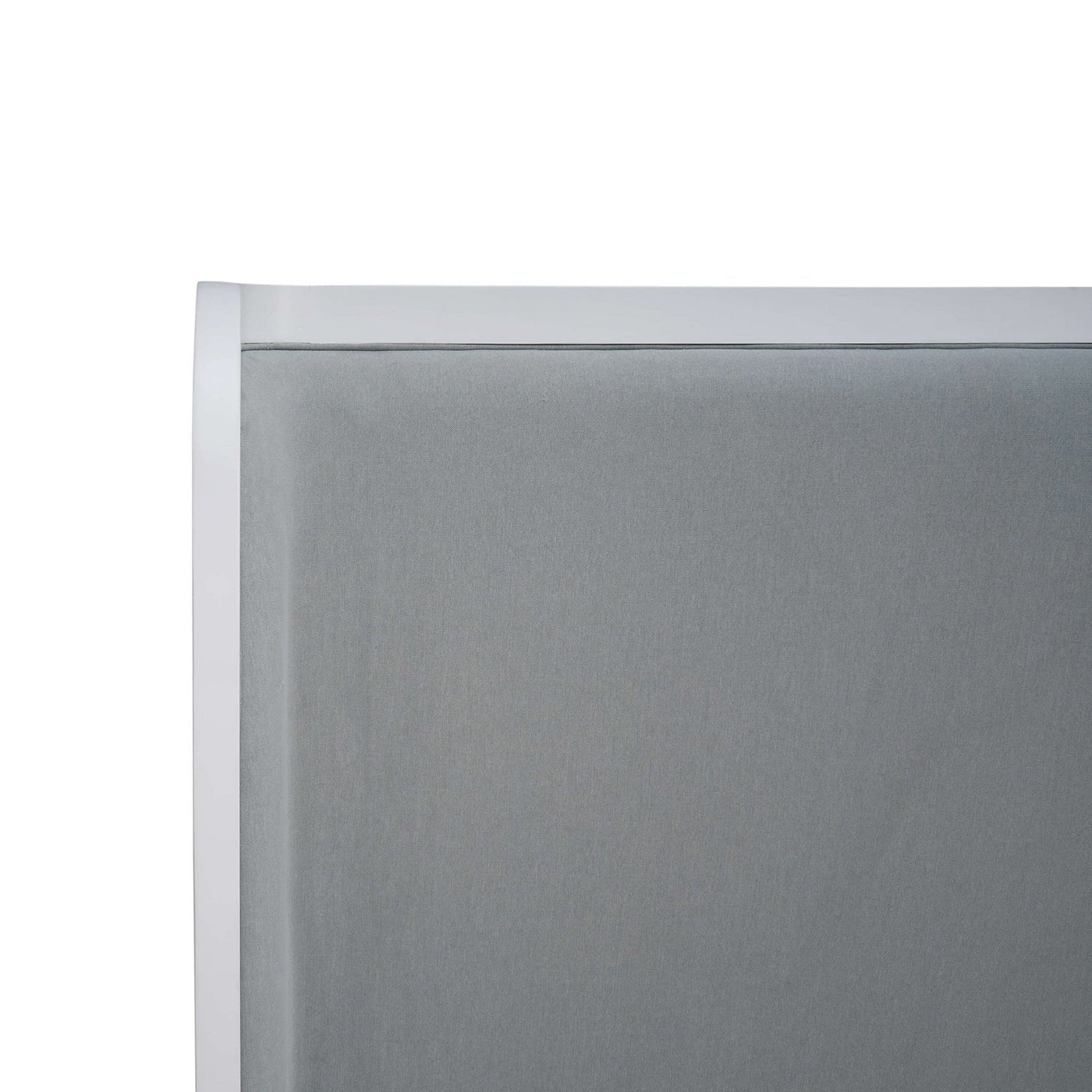 Close-up of headboard on upholstered linen king bed.