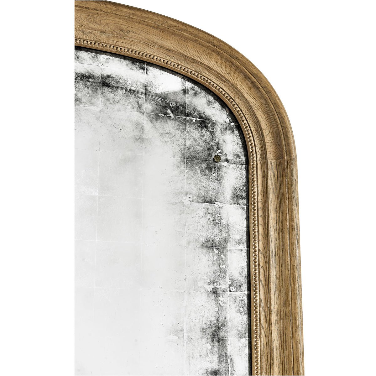Close-up of wood frame and distressed mirror edge.