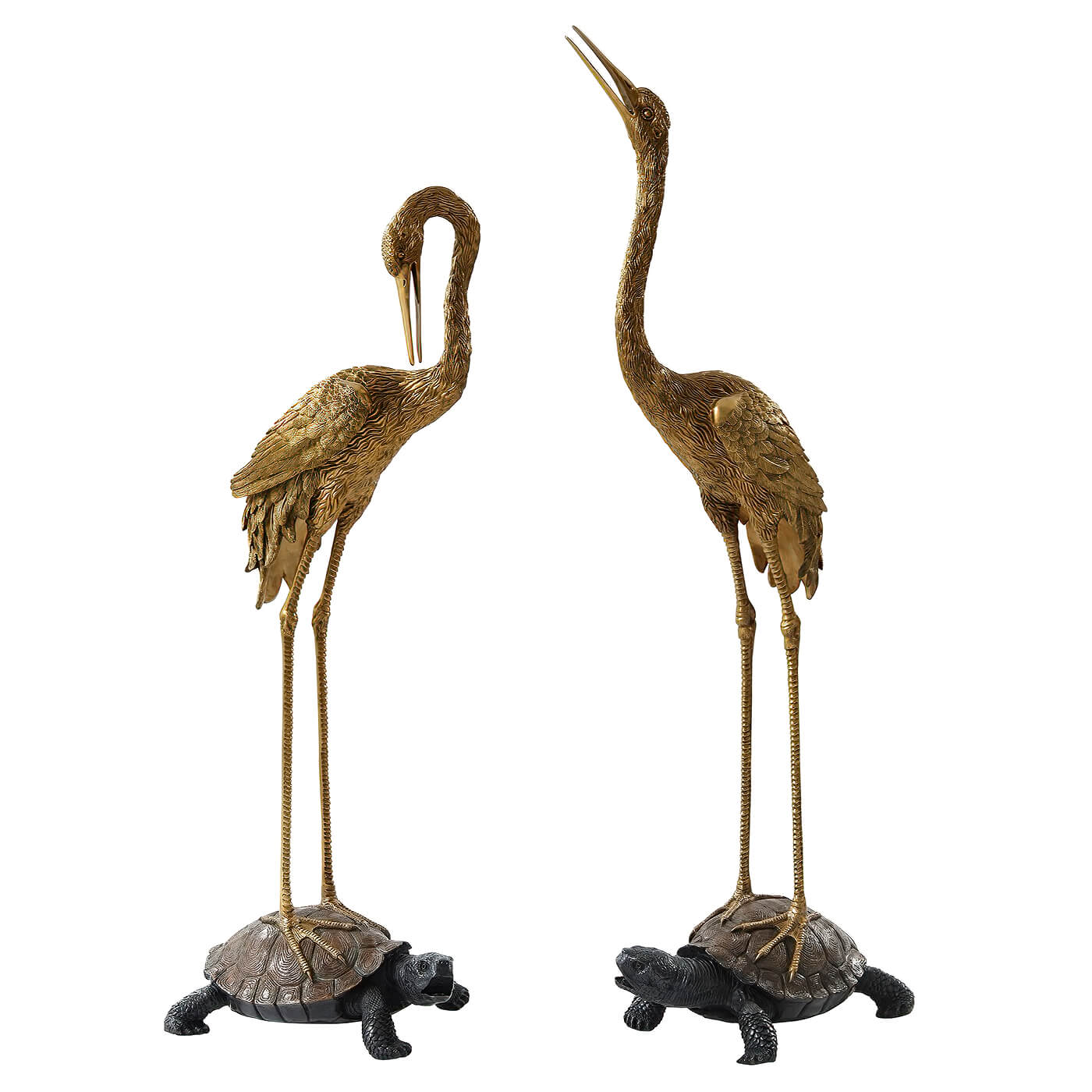 Large crane statues on turtles, full view.