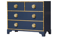 Navy dresser with gold trim and round knobs.