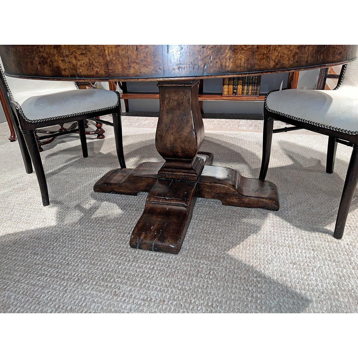 Close view of table base with chairs, wooden design.