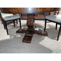 Close view of table base with chairs, wooden design.