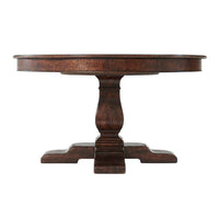Side profile of round dining table, wooden pedestal.