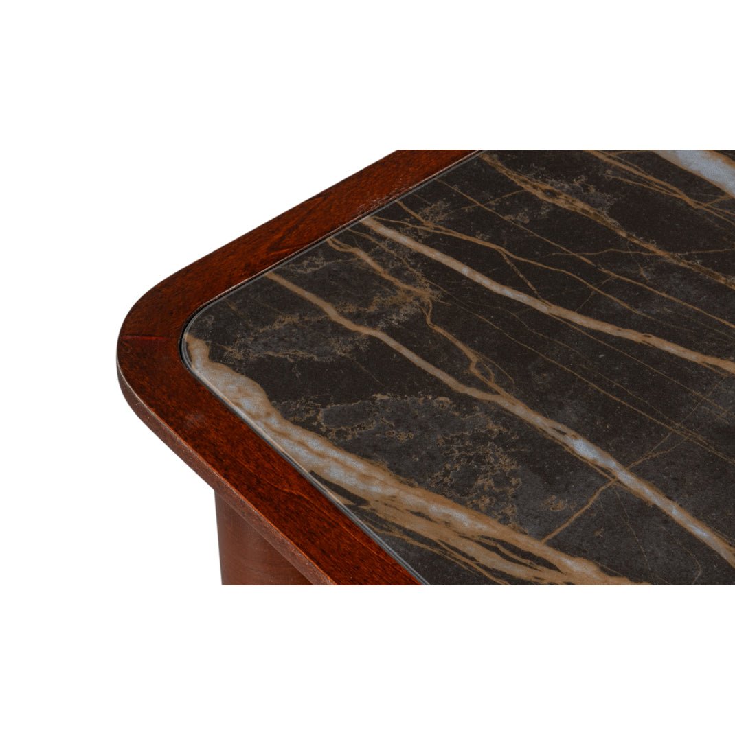 Close-up of marble top on faux bamboo dresser.