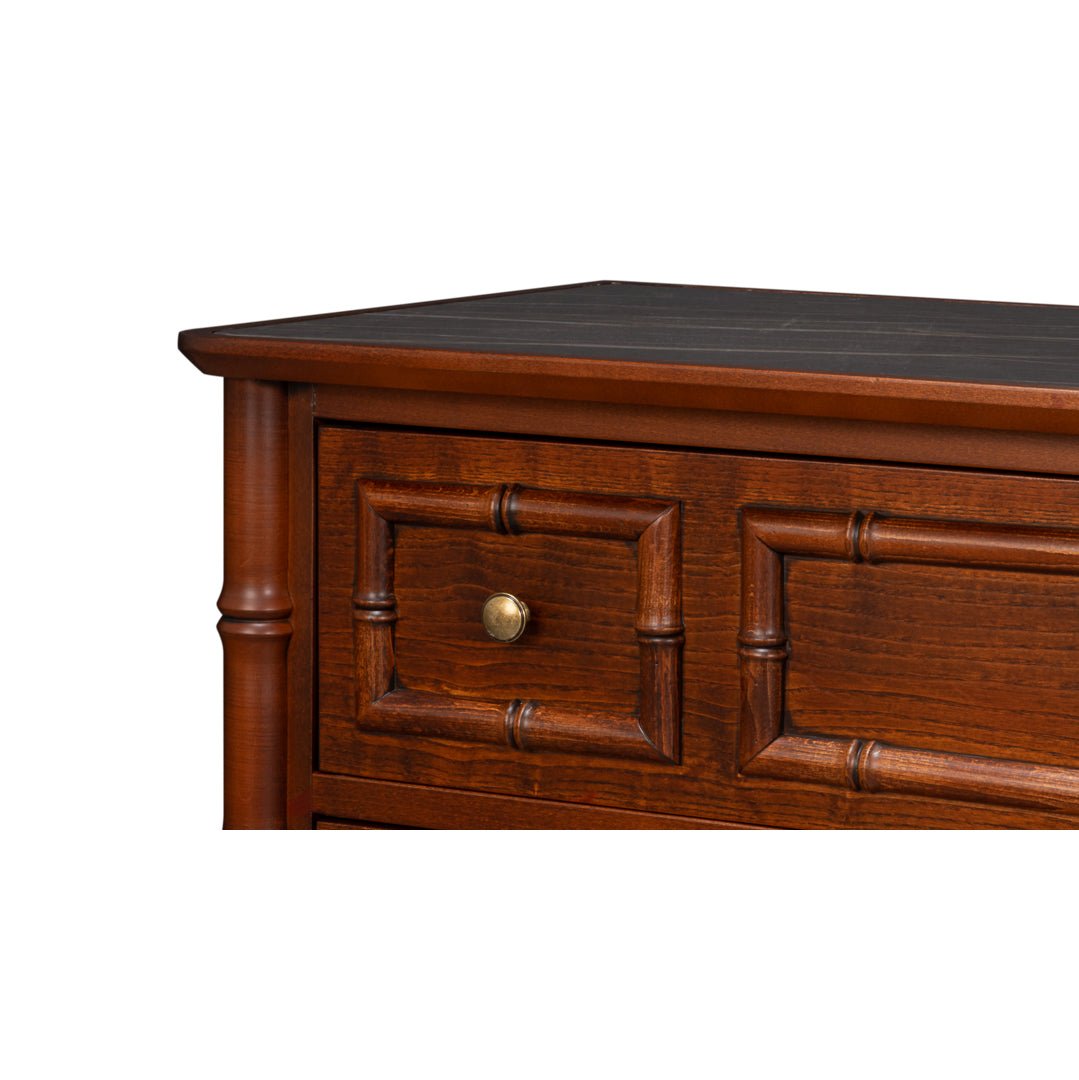 Top corner of faux bamboo dresser showing drawer details.