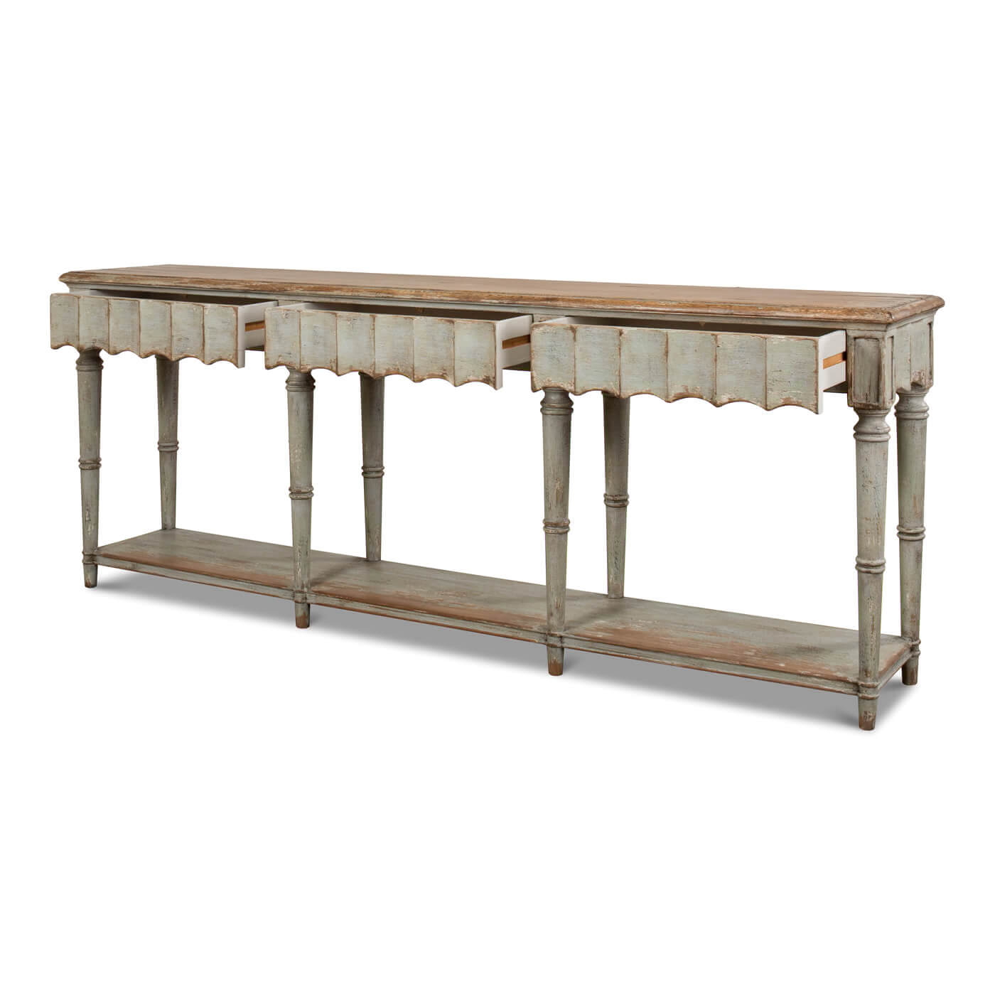 French Country console table with visible scalloped apron, angled view.