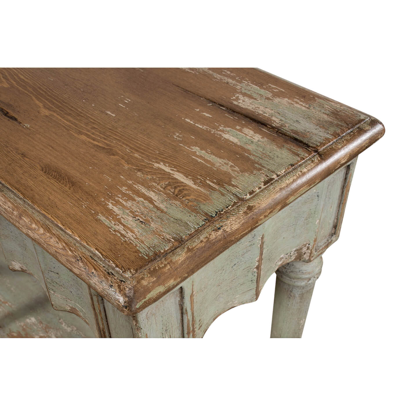 Corner detail of French Country console table with distressed finish.
