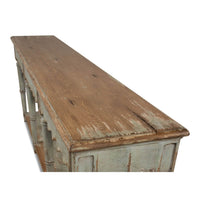 Close-up of wood grain on French Country console table top.