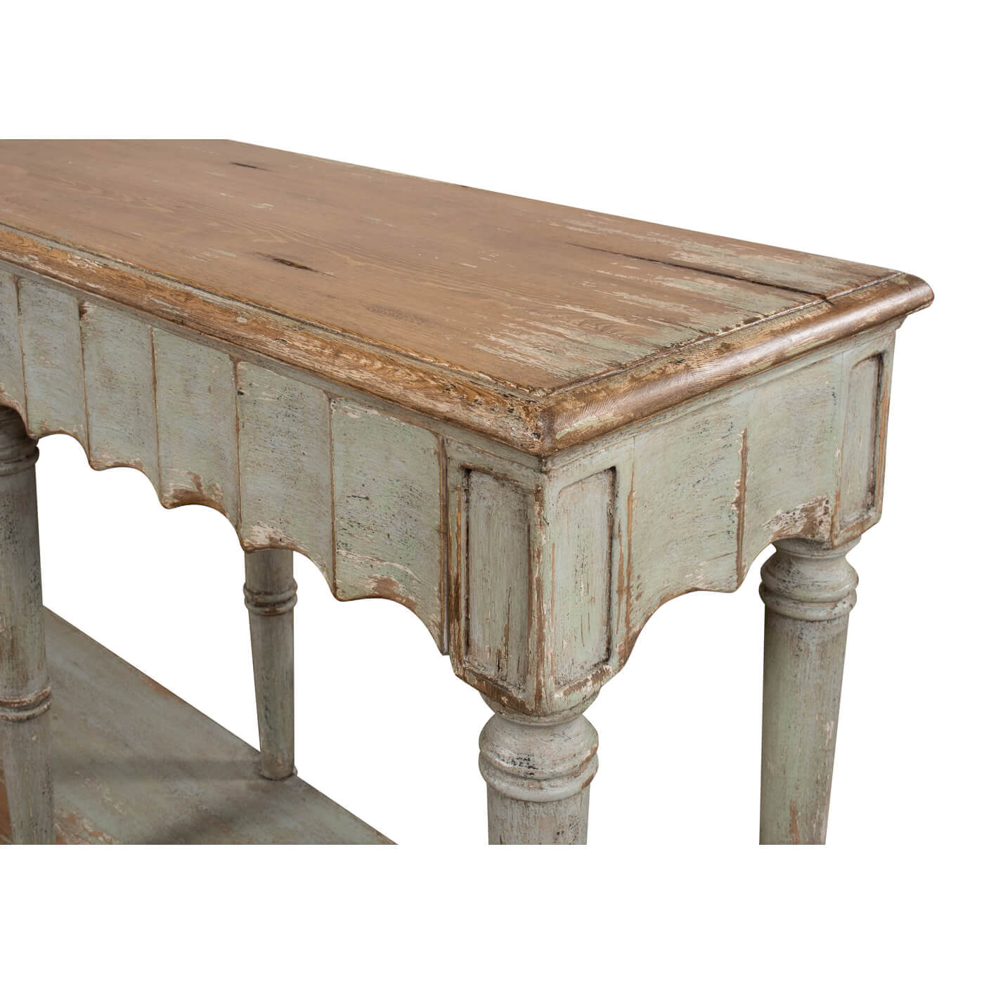 French Country console table leg and apron detail, close-up.