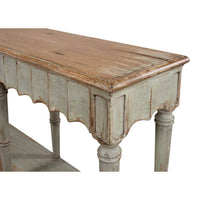 French Country console table leg and apron detail, close-up.