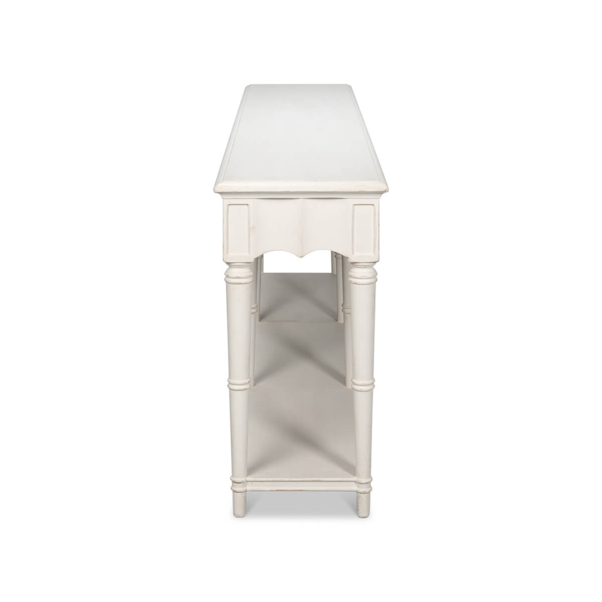 End view of antique white console table.
